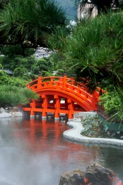 Orange bridge over a small lake leading to the Golden Pagoda, Nan Lian Garden, Kowloon (Diamond Hill), Hong Kong