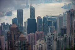 View to the harbour and commercial district from Victoria Peak with low lying cloud and pollution haze, Hong Kong Photo: Peter Llewellyn