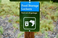 Sign for bear proof food lockers for campers , Spray Lakes Provincial Park, Kananaskis Country, Alberta, Canada.
