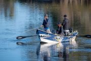 Fly fishermen with float boat on the Bow River, Carburn Park, Calgary, Alberta, Canada