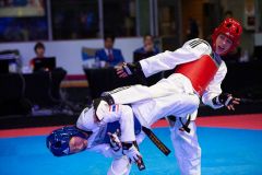 Burnaby, Canada. 16 November, 2016. WTF World Taekwondo Junior Championships, Teodora Jovic (SRB) in blue and Kiana Chai Chong (USA) in red compete in girls 42kg class.