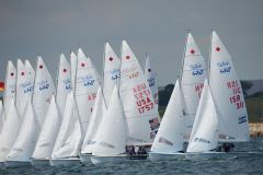 The fleet heads off from the start, 470, women's two person dinghy, Sailing Olympic Test Event, Weymouth, England, Photo by: Peter Llewellyn