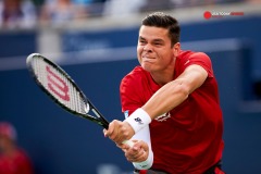 Aug 6, 2014; Toronto, Ontario, Canada; Milos Raonich (CAN) hits a backhand against Jack Sock (USA) on day three of the Rogers Cup tennis tournament at Rexall Centre. Mandatory Credit: Peter Llewellyn-USA TODAY Sports