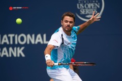 Aug 7, 2014; Toronto, Ontario, Canada; Stan Wawrinka (SUI) hits a backhand slice against  Kevin Anderson (RSA) on day four of the Rogers Cup tennis tournament at Rexall Centre. Mandatory Credit: Peter Llewellyn-USA TODAY Sports