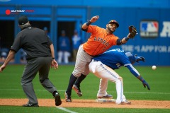Jun 7, 2015; Toronto, Ontario, CAN; Houston Astros Jonathan Villar (2) fails to make a catch from an RBI single by Toronto Blue Jays right fielder Jose Bautista (19) (not in picture) as short stop Jose Reyes (7) ducks in the ninth inning at Rogers Centre. Toronto Blue Jays beat Houston Astros 7-6. Mandatory Credit: Peter Llewellyn-USA TODAY Sports