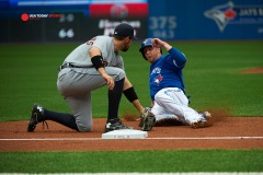 August 29 2015: Detroit Tigers Second base Ian Kinsler (3) [4986] tags out Toronto Blue Jays First base Justin Smoak (13) [7658] at third base in the first inning at Rogers Centre in Toronto, ON, Canada.