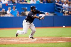 Aug 31, 2015; Toronto, Ontario, CAN; Cleveland Indians Abraham Almonte (35) bunts for a single against Toronto Blue Jays in the third inning at Rogers Centre. Mandatory Credit: Peter Llewellyn-USA TODAY Sports