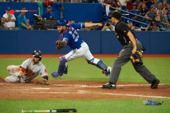 September 19 2015: Toronto Blue Jays Catcher Russell Martin (55) [5276] fails to tag Boston Red Sox Second base Dustin Pedroia (15) [4969] to score from Boston Red Sox Designated hitter David Ortiz (34) [1937] hitters RBI single in the ninth inning during 7 - 6 win against Toronto Blue Jays at Rogers Centre in Toronto, ON, Canada.