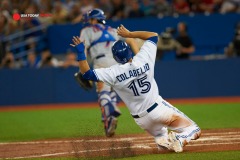 Jun 18, 2015; Toronto, Ontario, CAN; Toronto Blue Jays left fielder Toronto Blue Jays Chris Colabello (15) slides home from an RBI single off centre fielder Kevin Pillar (11) in the second inning against New York Mets at Rogers Centre. Mandatory Credit: Peter Llewellyn-USA TODAY Sports