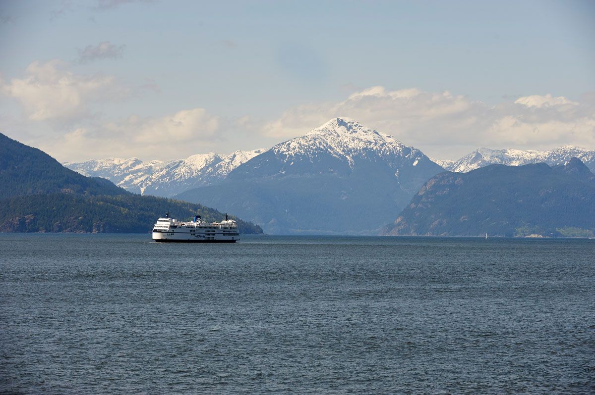 BC Ferries Queen of Oak Bay with Sunshine Coast Mountains behind HorseShoe Bay Vancouver British Columbia Canada