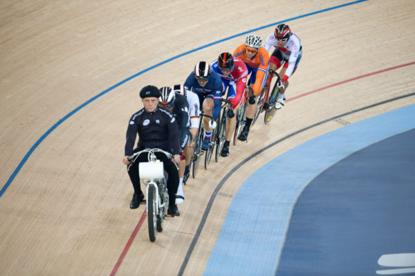 London, England, 12-02-18. Competitors follow the motorcycle pace bike in the finals of the men's Keirin at the UCI World Cup, Track Cycling, Olympic Velodrome, London. Part of the London Prepares Olympic preparations.