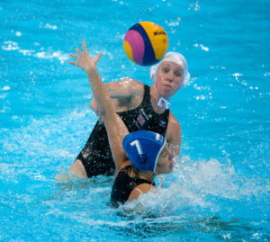 London, England, 05-05-12. Fran LEIGHTON (GBR) takes a shot while Bianka POCSI (HUN) defends during the Great Britain v Hungary game in the VIsa Water Polo Invitational. Part of the London Prepares Olympic preparations.