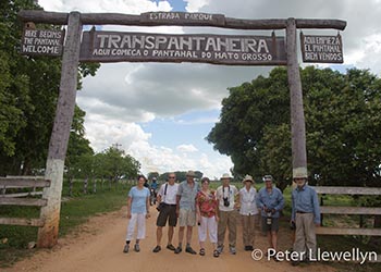 Workshop participants at entrance to the Trans Panatanerira Highway, The Pantanal, Mato Grosso, Brazil