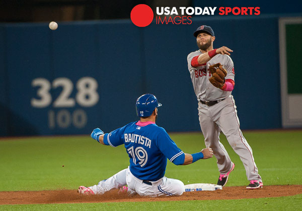 May 10, 2015; Toronto, Ontario, CAN; Boston Red Sox second base Dustin Pedroia (15) turns a double play as Toronto Blue Jays designated hitter Jose Bautista (19) slides to seconds base in eighth inning at Rogers Centre. Red Sox beat Blue Jays 6 - 3 Mandatory Credit: Peter Llewellyn-USA TODAY Sports